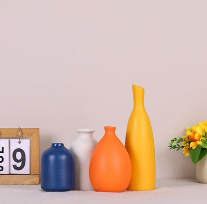 Juego de 4 tarros pequeños de cerámica coloridos para decoración del hogar. 