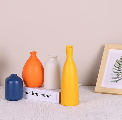 Juego de 4 tarros pequeños de cerámica coloridos para decoración del hogar. 