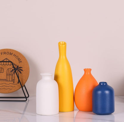 Juego de 4 tarros pequeños de cerámica coloridos para decoración del hogar. 
