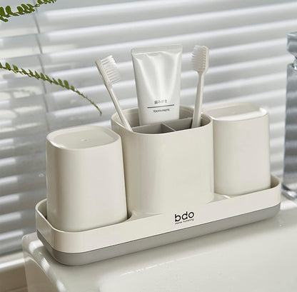 Soporte para cepillos de dientes con taza para cepillos de dientes. 