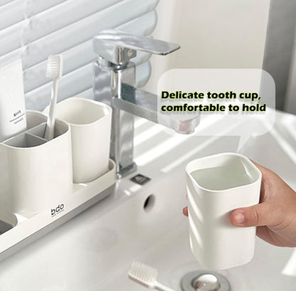 Soporte para cepillos de dientes con taza para cepillos de dientes. 